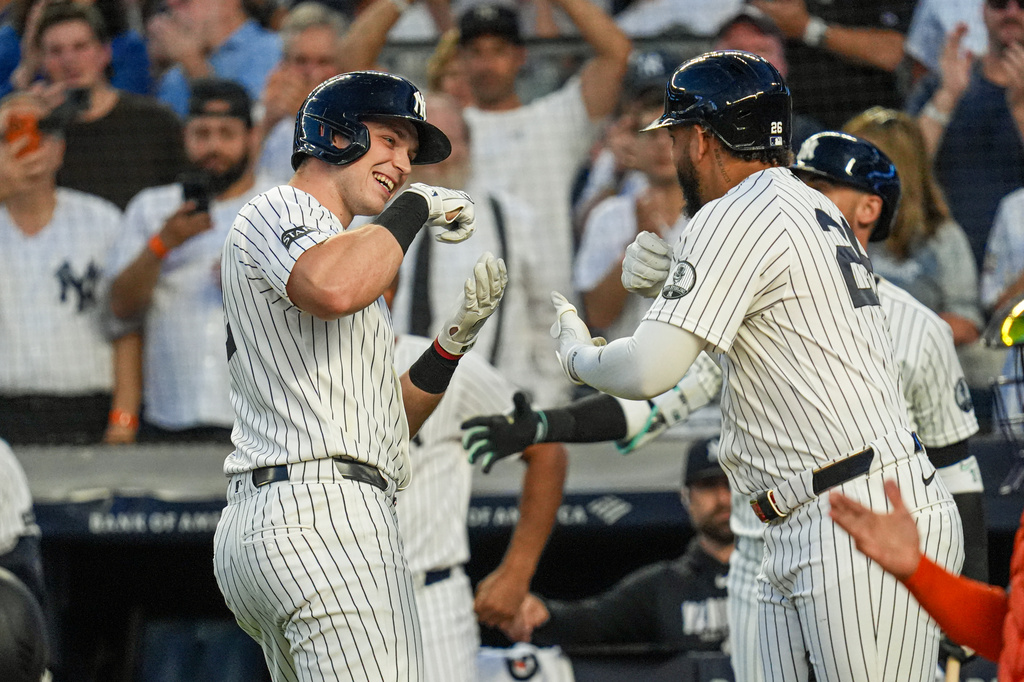 New York Yankees designated hitter Ben Rice, right, celebrates with teammate first baseman Luis García Jr. after hitting a solo home run during the first inning of a baseball game against the Houston Astros Wednesday, Aug. 26, 2026, in New York. (AP Photo/Ryan Murphy)