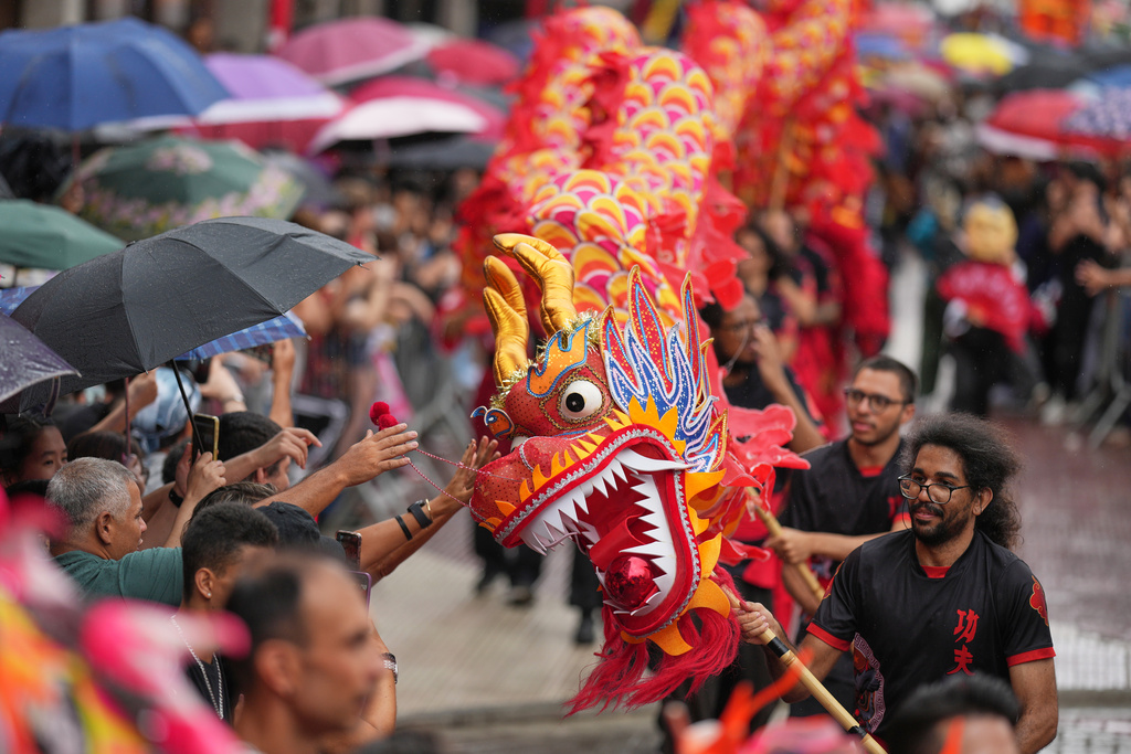 FILE - Dancers perform a dragon dance celebrating the Chinese Lunar New Year in the Asian neighborhood of Liberdade, in Sao Paulo, Jan. 31, 2026, marking the beginning of the Year of the Horse. (AP Photo/Andre Penner, File)