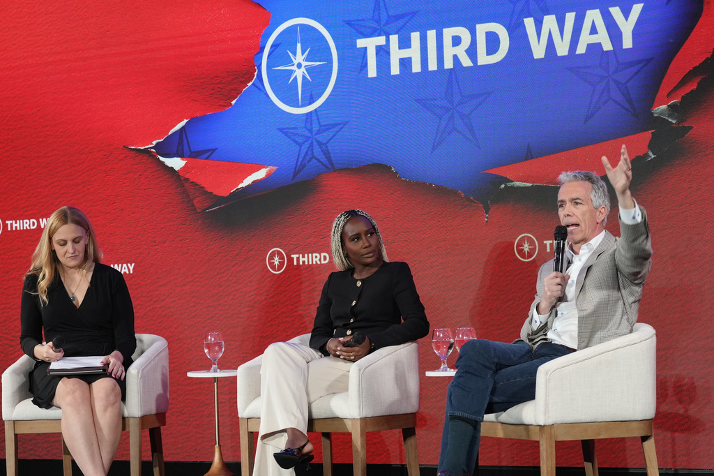 Former Rep. Joe Walsh, RIll., right, speaks about becoming a Democrat as moderator Sarah McCammon and panelist Yemisi Egbewole listen during Third Way's "Winning the Middle" conference Monday, March 2, 2026, in Charleston, S.C. (AP Photo/Meg Kinnard)