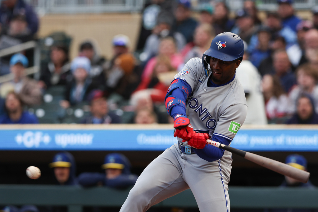 Toronto Blue Jays' Jesús Sánchez hits a ground ball to Minnesota Twins shortstop Brooks Lee during the first inning of a baseball game Friday, May 1, 2026, in Minneapolis. (AP Photo/Stacy Bengs)