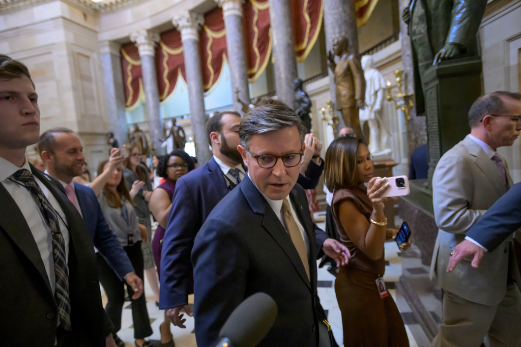 Speaker of the House Mike Johnson, R-La., talks with reporters as he walks to his office following a vote at the Capitol, Tuesday, June 30, 2026, in Washington. (AP Photo/Rod Lamkey, Jr.)