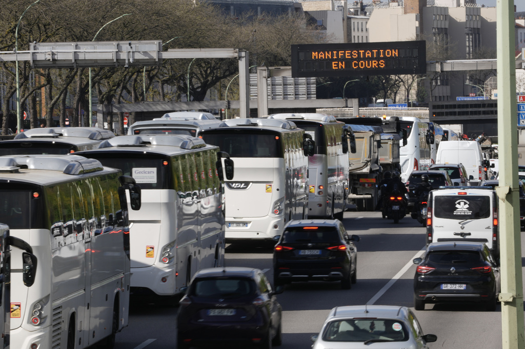 Protesting truck and bus drivers slow traffic down along Paris' ring road to denounce higher fuel prices, Monday, March 30, 2026. (AP Photo/Thibault Camus)