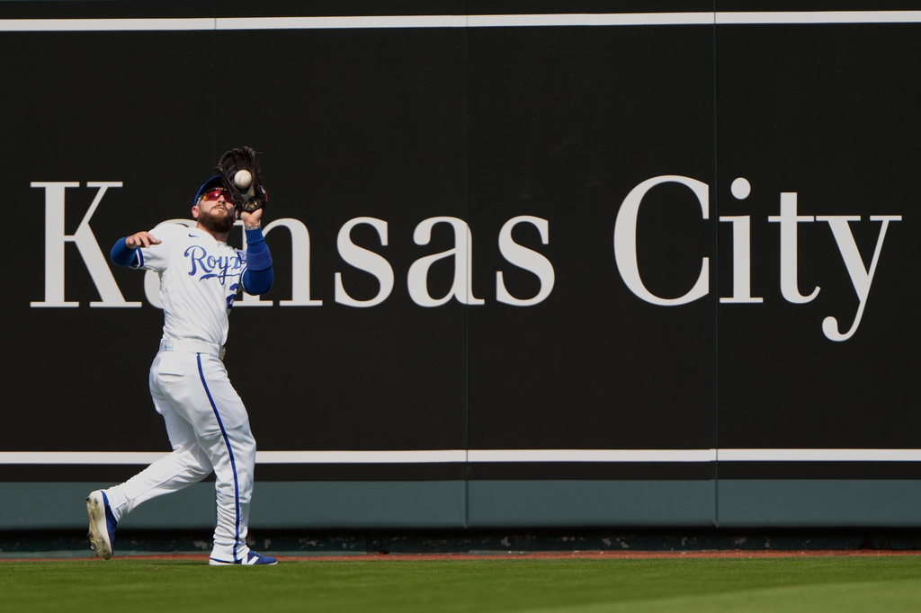 Kansas City Royals center fielder Kyle Isbel catches a fly ball for the out on Minnesota Twins' Ryan Jeffers during the first inning of a baseball game, Monday, March 30, 2026, in Kansas City, Mo. (AP Photo/Charlie Riedel)