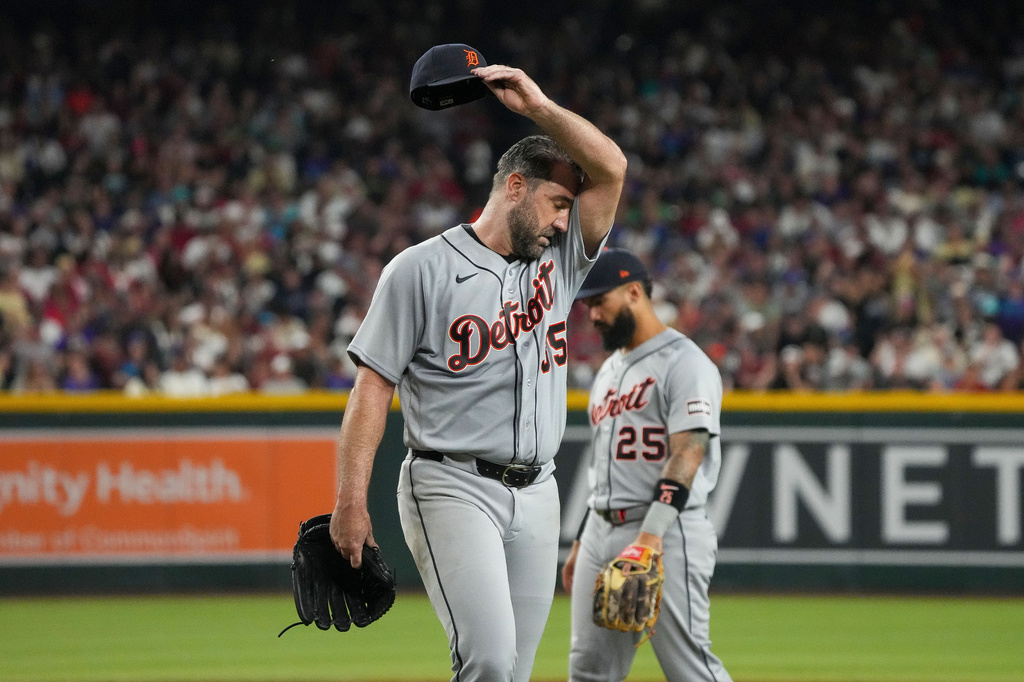 Detroit Tigers pitcher Justin Verlander wipes his brow as he walks off the field during the fourth inning of an opening-day baseball game against the Arizona Diamondbacks Monday, March 30, 2026, in Phoenix. (AP Photo/Darryl Webb)