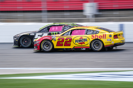 Joey Logano (22) looks to pass Ty Gibbs, left, during a NASCAR Cup Series auto race at Charlotte Motor Speedway, Sunday, Oct. 5, 2025, in Concord, N.C. (AP Photo/Matt Kelley) Joey Logano (22) looks to pass Ty Gibbs, left, during a NASCAR Cup Series auto race at Charlotte Motor Speedway, Sunday, Oct. 5, 2025, in Concord, N.C. (AP Photo/Matt Kelley)