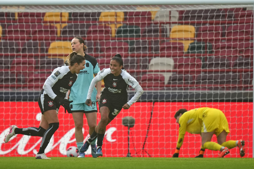 Corinthian's Gabi Zanotti, left, celebrates after scoring the opening goal during the Women's Champions Cup semifinal soccer match between Gotham FC and Corinthians in London, Wednesday, Jan. 28, 2026. (AP Photo/Alastair Grant)