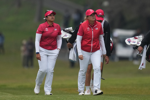 Lilia Vu of the United States, left, and Lauren Coughlin of the United States, arrive on the 3rd green during the final between the United States team and Australia team for the LPGA International Crown golf tournament at the New Korea Country Club in Goyang, South Korea, Sunday, Oct. 26, 2025. (AP Photo/Lee Jin-man) Lilia Vu of the United States, left, and Lauren Coughlin of the United States, arrive on the 3rd green during the final between the United States team and Australia team for the LPGA International Crown golf tournament at the New Korea Country Club in Goyang, South Korea, Sunday, Oct. 26, 2025. (AP Photo/Lee Jin-man)