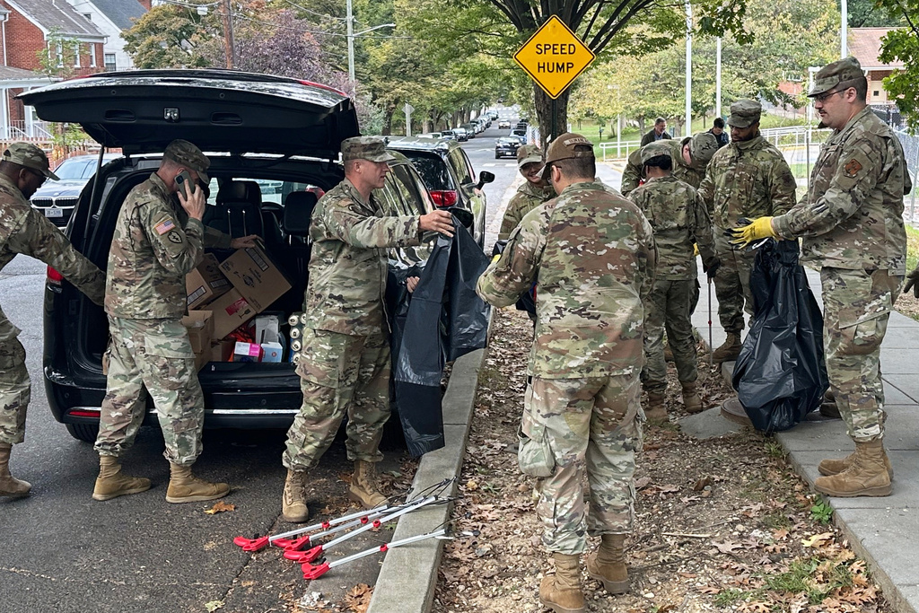 D.C. National Guard members clean up the park around Fort Stevens Recreation Center, Saturday, Oct. 11, 2025, in Washington. News of the cleanup sparked a community debate over the presence of the Guard. (AP Photo/Gary Fields)