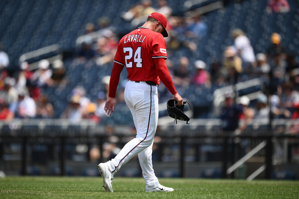 Washington Nationals pitcher Cade Cavalli walks back to the dugout after he was pulled during the third inning of a baseball game against the Pittsburgh Pirates, Sunday, July 5, 2026, in Washington. (AP Photo/Nick Wass)