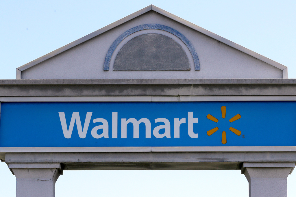 FILE - A Walmart sign stands outside a store, Sept. 3, 2019, in Walpole, Mass. (AP Photo/Steven Senne, File)