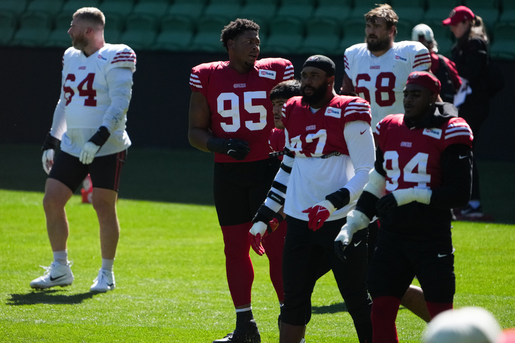 San Francisco 49ers defensive lineman Alfred Collins, center, works out during practice Tuesday, Sept. 8, 2026, in Melbourne, Australia, in preparation for an NFL football game against the Los Angeles, Rams. (AP Photo/Asanka Brendon Ratnayake)