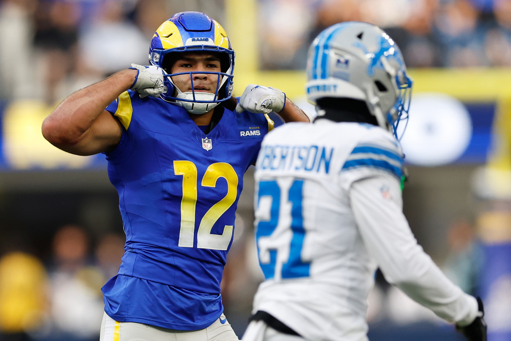 Los Angeles Rams wide receiver Puka Nacua (12) reacts after a catch during the first half of an NFL football game against the Detroit Lions, Sunday, Dec. 14, 2025, in Inglewood, Calif. (AP Photo/Caroline Brehman)