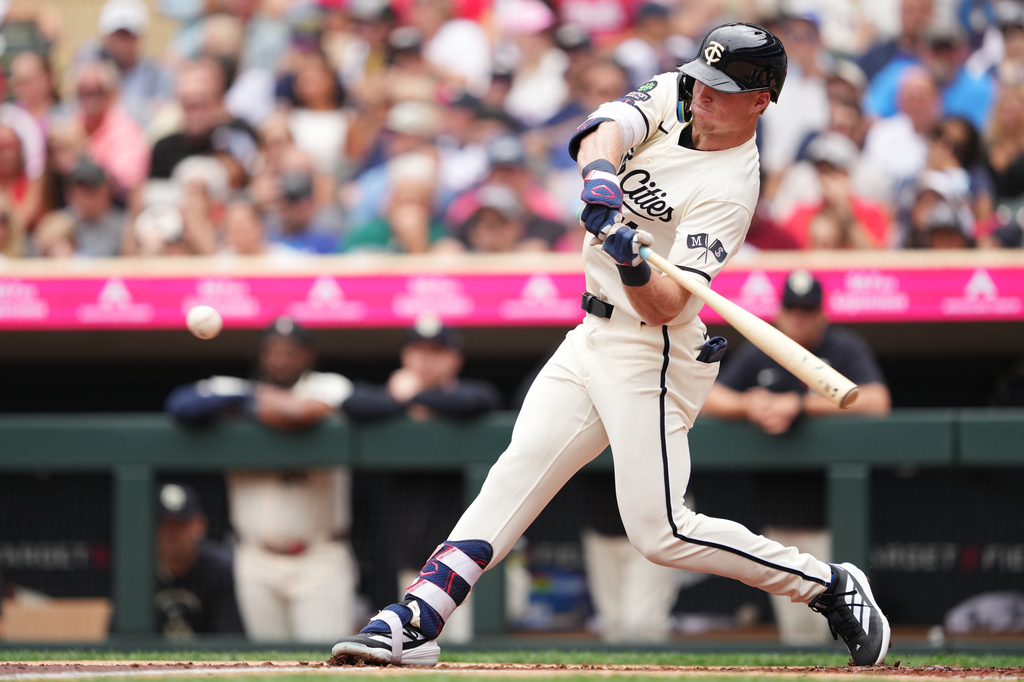 Minnesota Twins' Walker Jenkins grounds into an RBI fielder's choice during the first inning of a baseball game against the Chicago White Sox, Saturday, Aug. 29, 2026, in Minneapolis. (AP Photo/Ellen Schmidt)