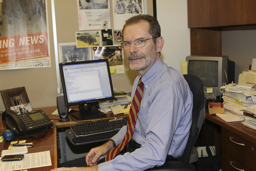 Paul Colford pauses for a photo at his desk at the Associated Press headquarters, Tuesday, Oct. 12, 2010, in New York. (AP Photo/Santos Chaparro)