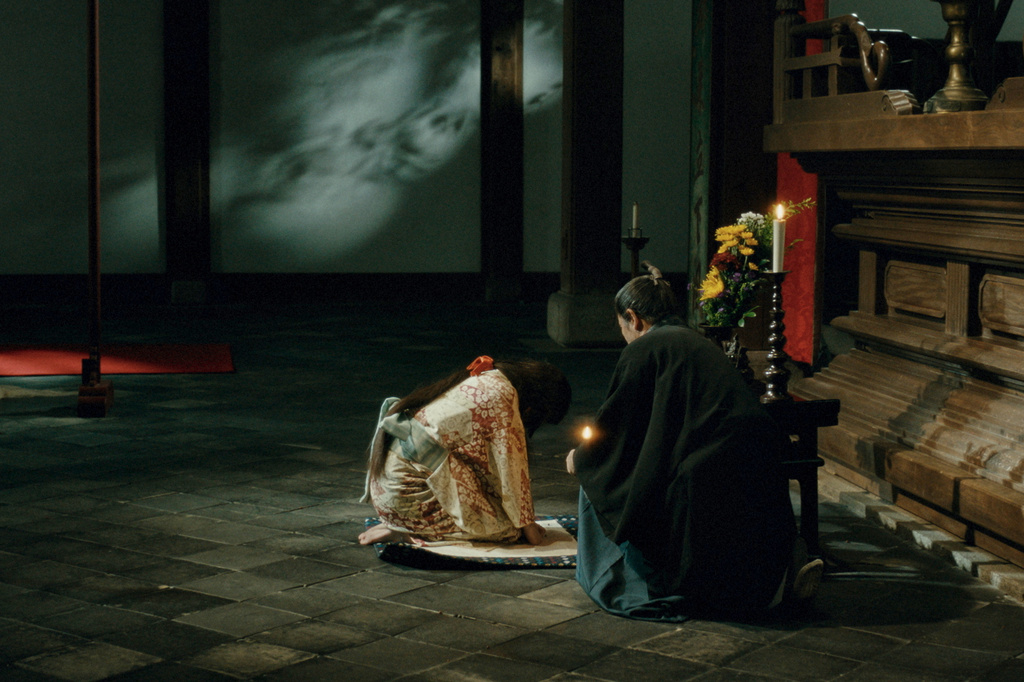 This image released by Janus Films shows Yuriko Yoshitaka, left, and Masahiro Motoki in a scene from "The Samurai and the Prisoner." (Janus Films via AP)