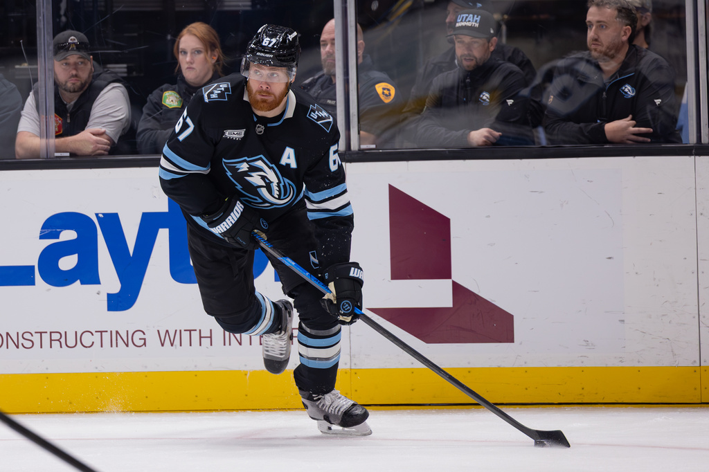 Utah Mammoth left wing Lawson Crouse skates with the puck during the second period of an NHL hockey game against the Tampa Bay Lightning, Saturday, Oct. 24, 2026, in Salt Lake City. (AP Photo/Melissa Majchrzak)