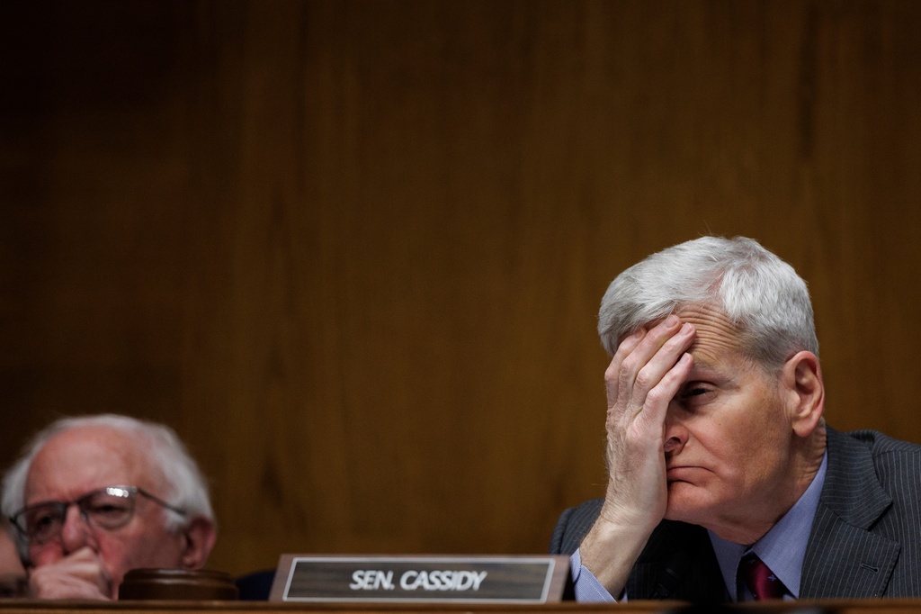 Committee Chair Senator Bill Cassidy R-La. holds his head as Dr. Casey Means testifies during a Senate Health, Education Labor and Pension Committee Conformation Hearing for U.S. Surgeon General on Capitol Hill on Wednesday, Feb. 25, 2026, in Washington. (AP Photo/Tom Brenner)