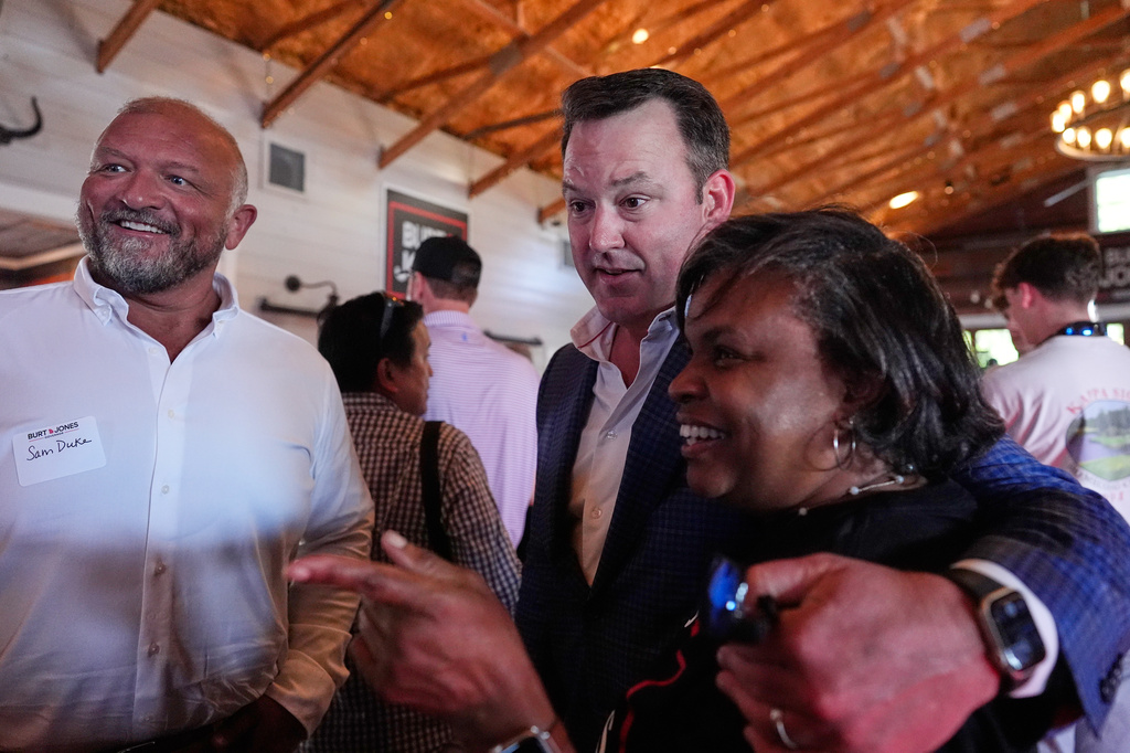 Georgia gubernatorial candidate Burt Jones meets with supporters during a primary election night watch party, Tuesday, May 19, 2026, in Jackson, Ga. (AP Photo/Mike Stewart)