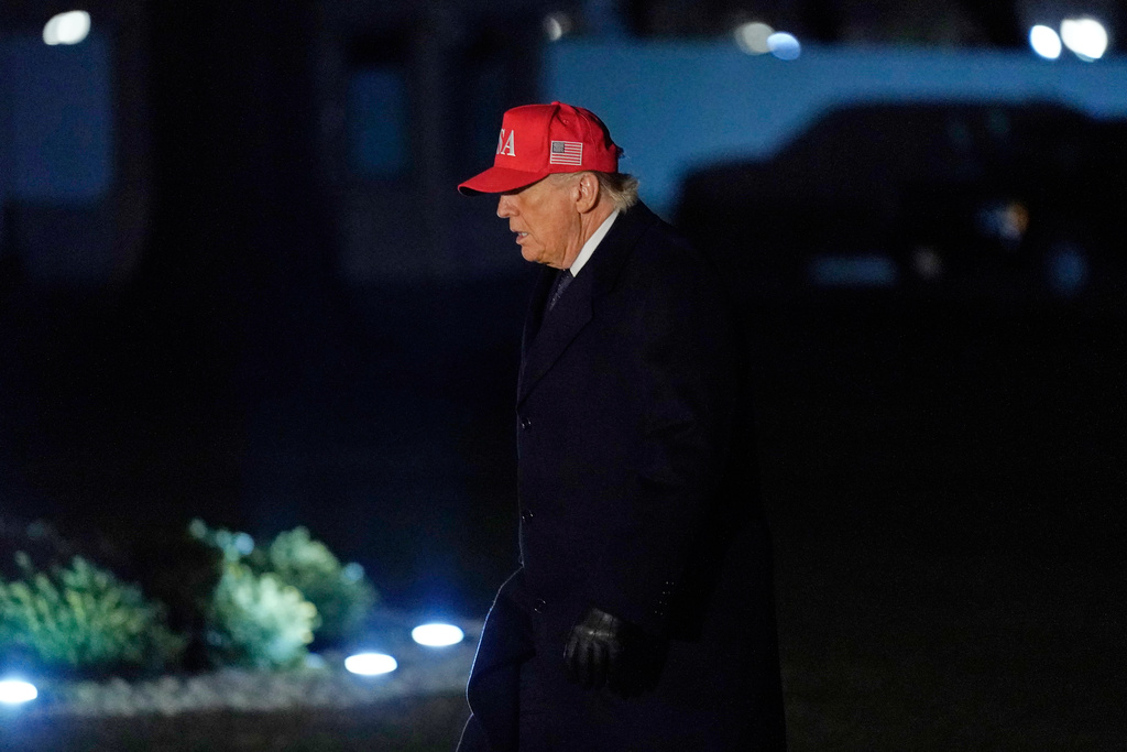 President Donald Trump walks from Marine One after arriving on the South Lawn of the White House, Sunday, March 1, 2026, in Washington. (AP Photo/Jose Luis Magana)