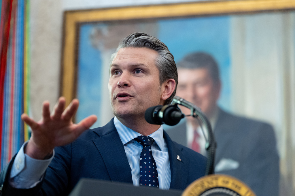 Defense Secretary Pete Hegseth speaks during the swearing-in for Homeland Security Secretary Markwayne Mullin in the Oval Office of the White House, Tuesday, March 24, 2026, in Washington. (AP Photo/Alex Brandon)