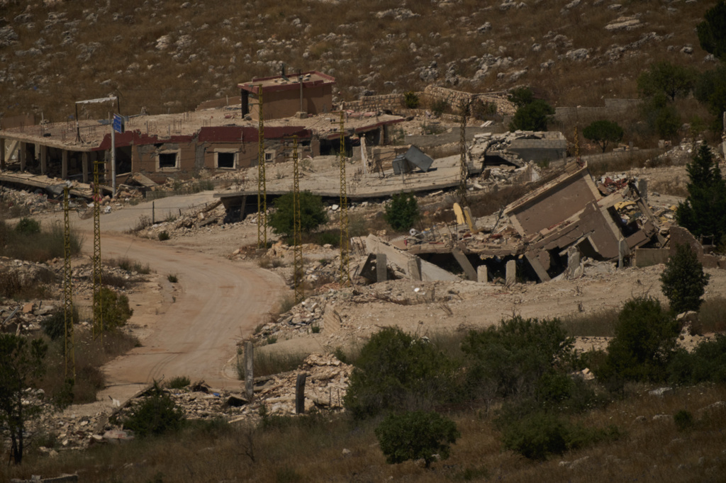 Destroyed buildings in a village in southern Lebanon as seen from northern Israel, Friday, June 26, 2026. (AP Photo/Leo Correa)