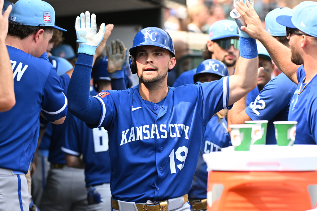 Kansas City Royals' Michael Massey (19) is congratulated by teammates after hitting a two-run home run during the eighth inning of a baseball game against the Detroit Tigers, Sunday, July 26, 2026, in Detroit. (AP Photo/Jose Juarez)