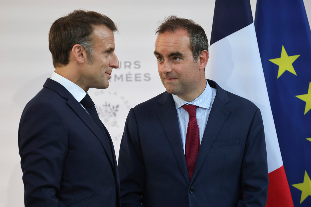FILE - Then French Defense minister Sebastien Lecornu, right, and France's President Emmanuel Macron talk at the end of an address by the president to army leaders in Paris Sunday July 13, 2025, (Ludovic Marin, Pool via AP, File)