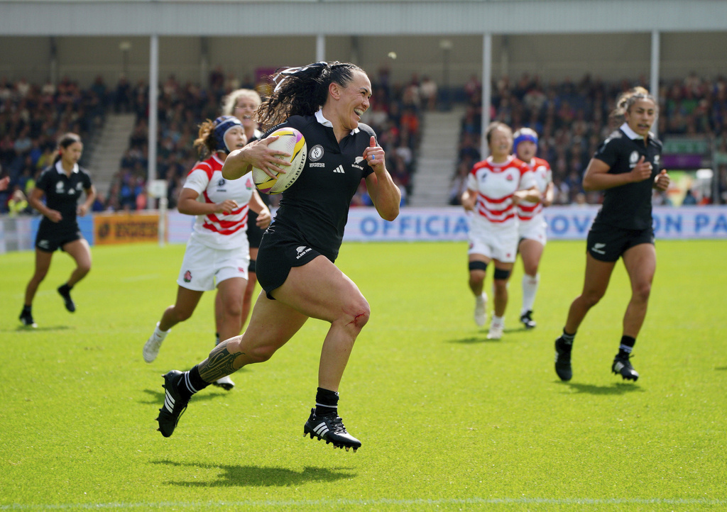 New Zealand's Portia Woodman-Wickliffe runs in to scores her side's first try during the Women's Rugby World Cup 2025 Pool C match between Japan and New Zealand at Sandy Park, Exeter, England, Sunday Aug. 31, 2025. (Ben Birchall/PA via AP)