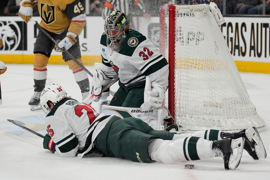 Minnesota Wild defenseman Jonas Brodin (25) stops a pass attempt by the Vegas Golden Knights during the second period of an NHL hockey game Friday, March 6, 2026, in Las Vegas. (AP Photo/John Locher)