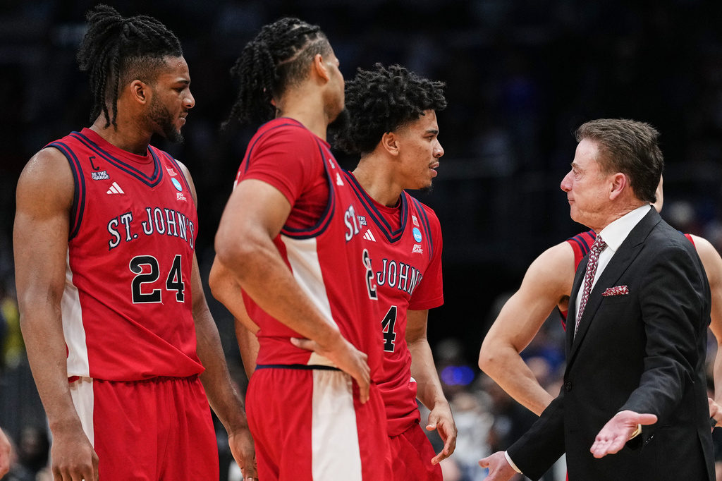 St. John's head coach Rick Pitino talks with his team during the second half against Duke in the Sweet 16 of the NCAA college basketball tournament, Friday, March 27, 2026, in Washington. (AP Photo/Abbie Parr)