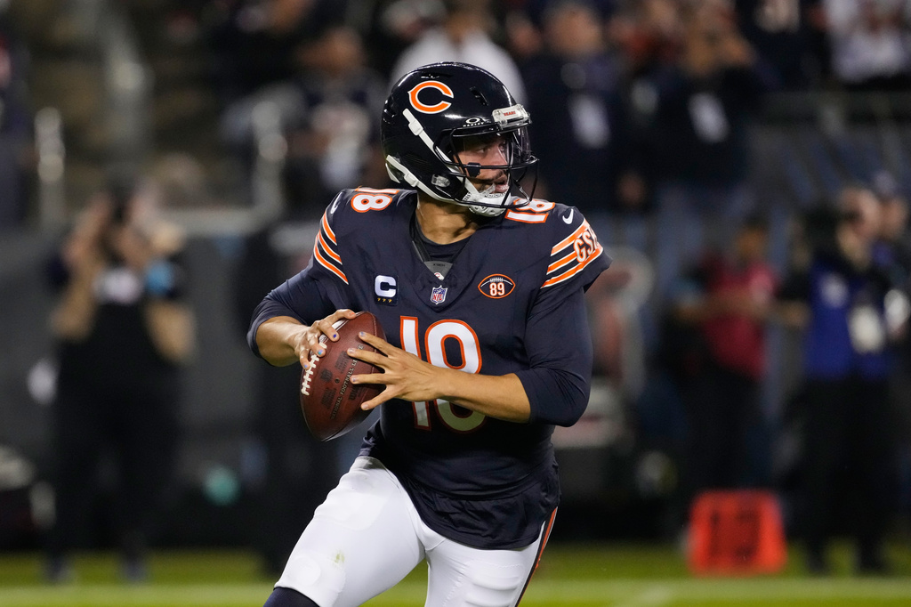 Chicago Bears quarterback Caleb Williams rolls out of the pocket during the first half of an NFL football game against the New England Patriots in Chicago, Thursday, Oct. 22, 2026. (AP Photo/Nam Y. Huh)