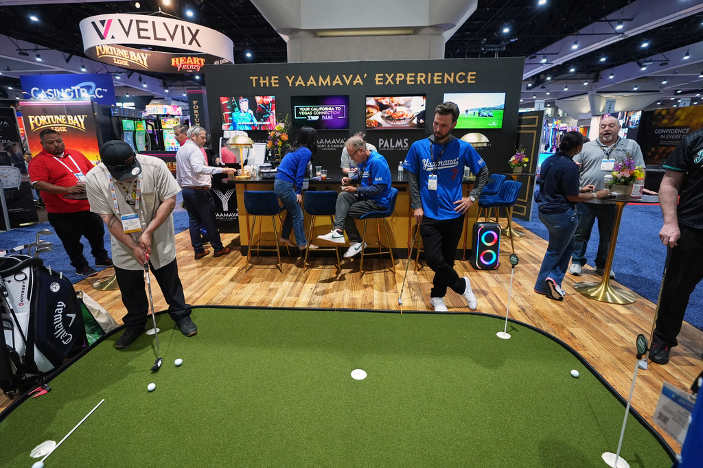 Convention attendees take part in a display from the Yaamava' Resort & Casino at the Indian Gaming Association's annual convention in San Diego, Thursday, April 2, 2026. (AP Photo/Gregory Bull)