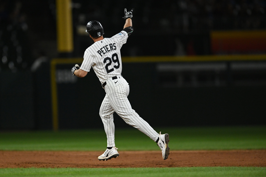 Chicago White Sox's Tristan Peters celebrates after hitting a two-run home during the fifth inning of a baseball game against the Texas Rangers in Chicago, Wednesday, Aug. 26, 2026. (AP Photo/Paul Beaty)
