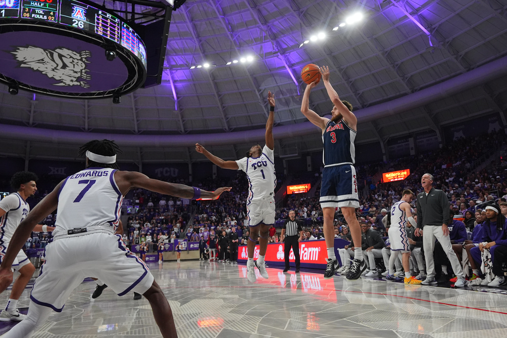 Arizona guard Anthony Dell'orso (3) shoots against TCU guard Jayden Pierre (1) during the first half of an NCAA college basketball game Saturday, Jan. 10, 2026, in Fort Worth, Texas. (AP Photo/LM Otero)