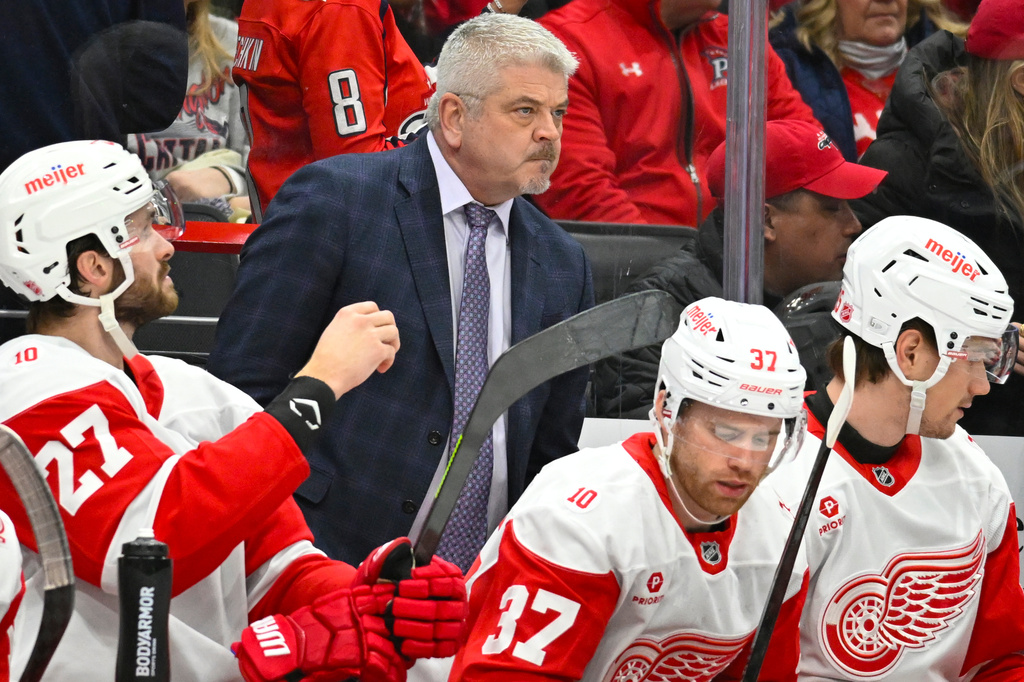 Detroit Red Wings head coach Todd McLellan watches the action from the bench during the first period of an NHL hockey game against the Washington Capitals, Saturday, Dec. 20, 2025, in Washington. (AP Photo/John McDonnell)