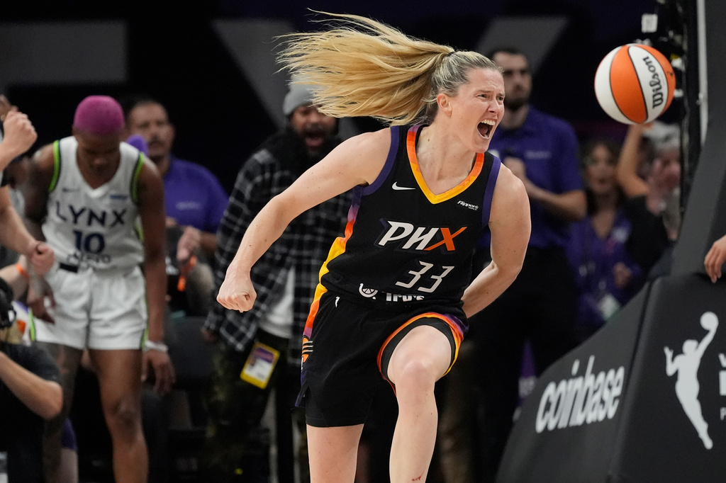 Phoenix Mercury guard Sami Whitcomb (33) celebrates her score against Minnesota Lynx guard Courtney Williams (10) during the first half of Game 3 of a WNBA basketball playoff semifinals series game Friday, Sept. 26, 2025, in Phoenix. (AP Photo/Ross D. Franklin)