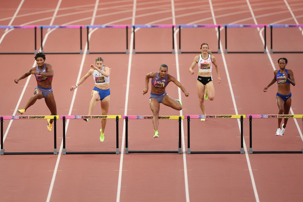 From left: Anna Cockrell, of the United States, Emma Zapletalova, of Slovakia, Jasmine Jones, of the United States, Paulien Couckuyt, of Belgium, and Dalilah Muhammad, of the United States, compete in the women's 400 meters hurdle final during the World Athletics Ultimate Championship in Budapest, Hungary, Sunday, Sept. 13, 2026. (AP Photo/Armin Durgut)