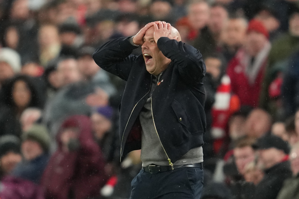Liverpool's manager Arne Slot reacts during the Champions League quarterfinal second leg soccer match between Liverpool and Paris Saint-Germain in Liverpool, England, Tuesday, April 14, 2026. (AP Photo/Jon Super)