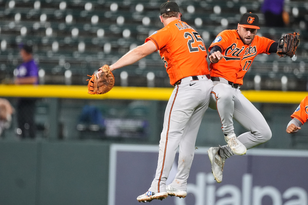 Baltimore Orioles first baseman Pete Alonso, left, celebrates with center fielder Colton Cowser after defeating the Colorado Rockies in a baseball game Monday, Aug. 31, 2026, in Denver. (AP Photo/David Zalubowski)
