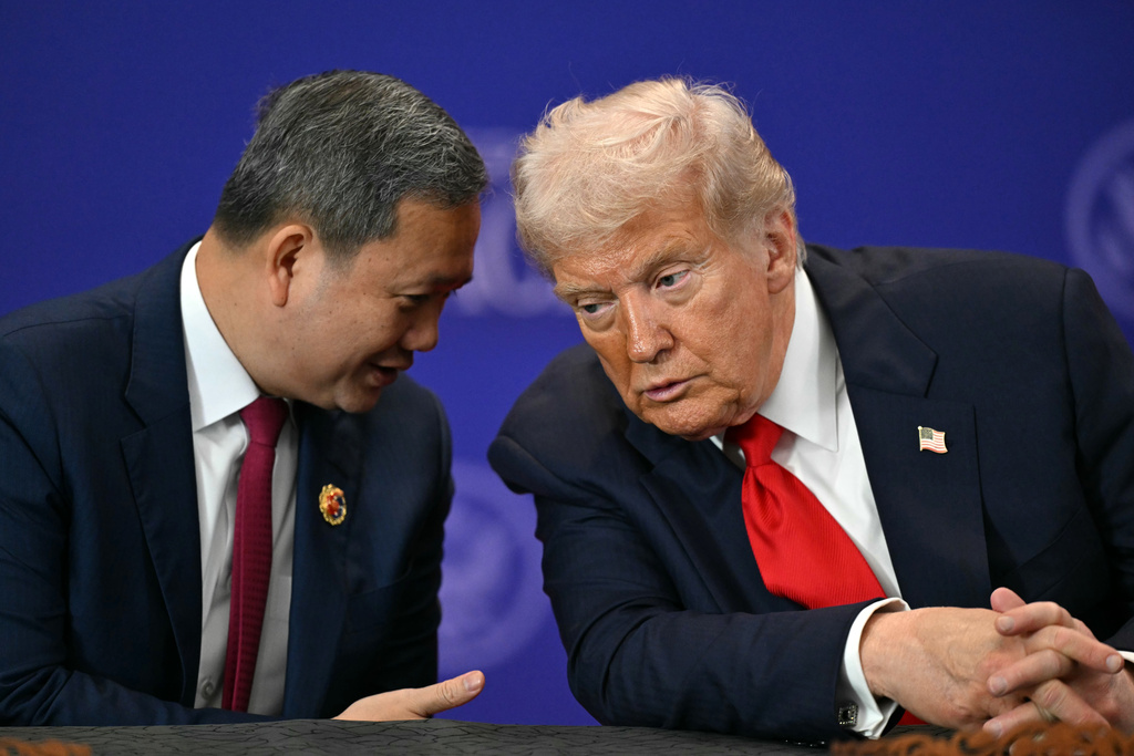 U.S. President Donald Trump listens to Cambodia's Prime Minister Hun Manet, left, ahead of the ceremonial signing of a ceasefire agreement between Thailand and Cambodia on the sidelines of the 47th Association of Southeast Asian Nations (ASEAN) summit in Kuala Lumpur, Malaysia, Sunday, Oct. 26, 2025. (Mohd Rasfan/Pool Photo via AP)