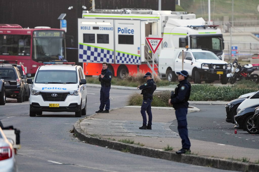 FILE - Police patrol in the early morning at Sydney's Bondi Beach, Dec. 15, 2025, following the previous day's shooting. (AP Photo/Mark Baker, File)