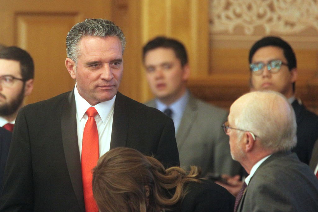 Kansas Senate President Ty Masterson, R-Andover, confers with members of the Legislature's staff before a meeting of legislative leaders to review a proposal for issuing bonds to help the Kansas City Chiefs build a new stadium on the Kansas side of the Kansas City metropolitan area, Monday, Dec. 22, 2025, at the Statehouse in Topeka, Kan. (AP Photo/John Hanna)