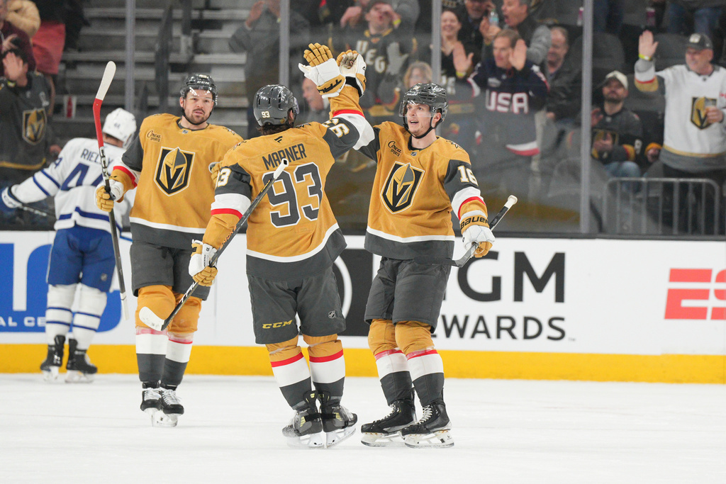 Vegas Golden Knights right wing Pavel Dorofeyev, right, celebrates his goal with right wing Mitch Marner (93) against the Toronto Maple Leafs during the first period of an NHL hockey game, Thursday, Jan. 15, 2026, in Las Vegas. (AP Photo/Candice Ward)
