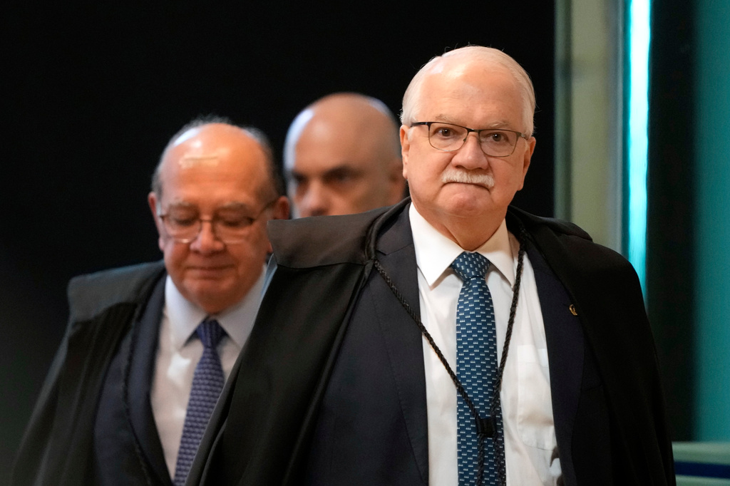 Supreme Court President Justice Edson Fachin, front, arrives to preside over a plenary session of the court in Brasilia, Brazil, Wednesday, Sept. 2, 2026. (AP Photo/Eraldo Peres)
