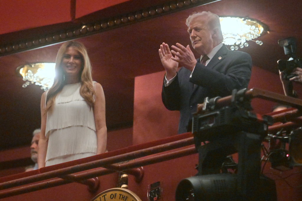 President Donald Trump and first lady Melania Trump arrive to attend the opening nights of the musical "Chicago" at the John F. Kennedy Center for the Performing Arts in Washington, Tuesday, March 31, 2026. (AP Photo/Rod Lamkey, Jr.)
