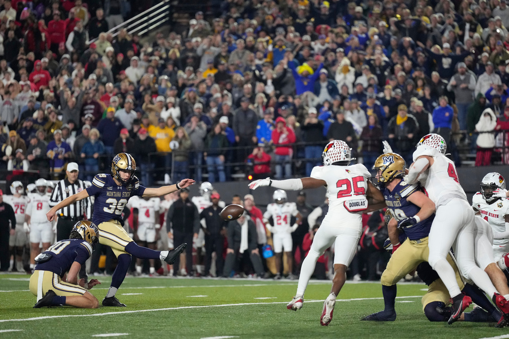 Montana State place-kicker Myles Sansted (39) kicks a point after try to win the FCS Championship NCAA college football game against Illinois State in overtime Monday, Jan. 5, 2026, in Nashville, Tenn. (AP Photo/George Walker IV)