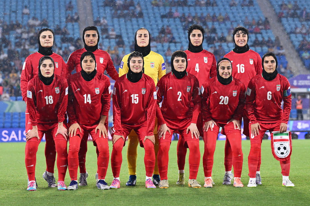 Iran players pose for a team photo ahead of the Women's Asian Cup soccer match between Iran and the Philippines in Robina, Australia, Sunday, March 8, 2026. (Dave Hunt/AAP Image via AP)
