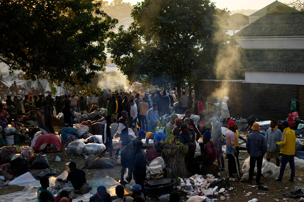 Malawian migrants stand in a queue ahead deportation, at a temporary centre in Durban, South Africa, Friday, June 19, 2026. (AP Photo/Themba Hadebe)