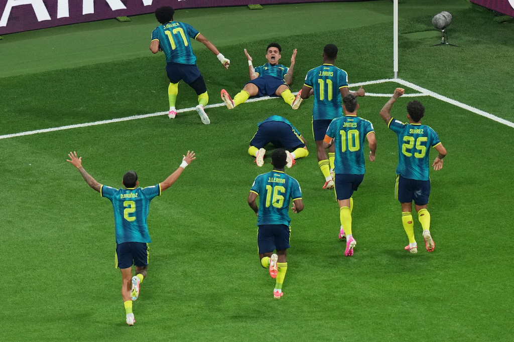 Colombia's Luis Diaz (7), top, celebrates with his teammates after scoring his side's second goal during the World Cup Group K soccer match between Uzbekistan and Colombia in Mexico City, Wednesday, June 17, 2026. (AP Photo/Silvia Izquierdo)