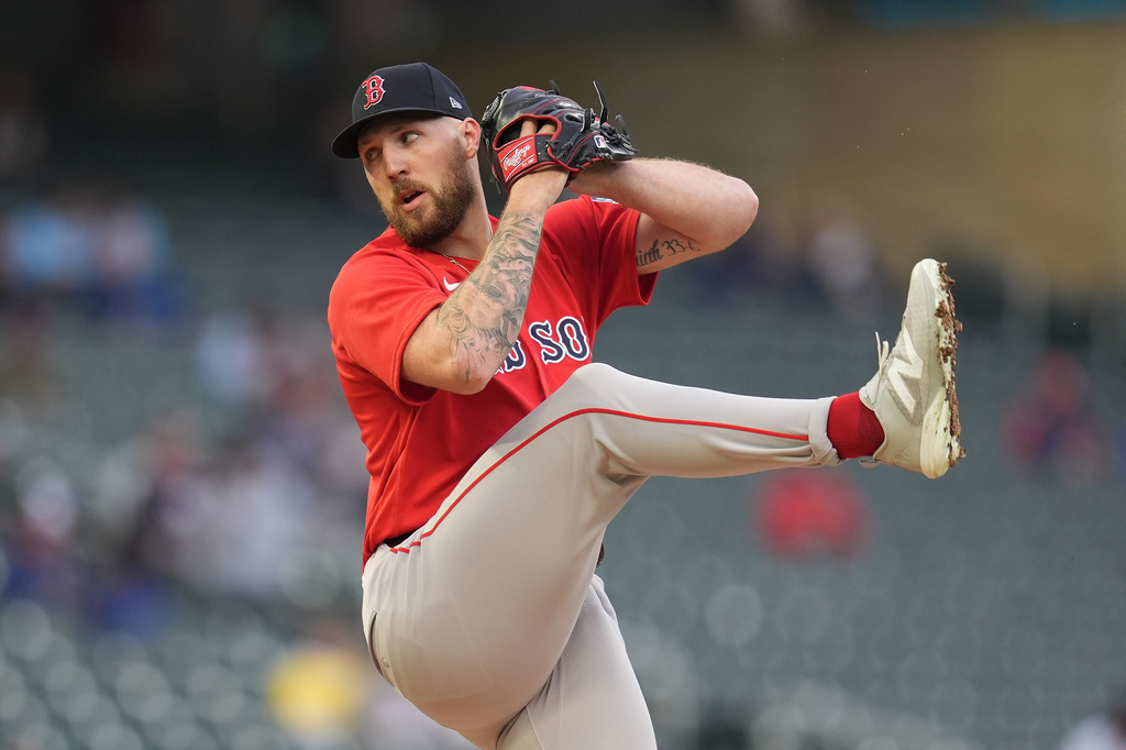 Boston Red Sox starting pitcher Garrett Crochet (35) winds up to deliver during the first inning of a baseball game against the Minnesota Twins Monday, April 13, 2026, in Minneapolis. (AP Photo/Abbie Parr)